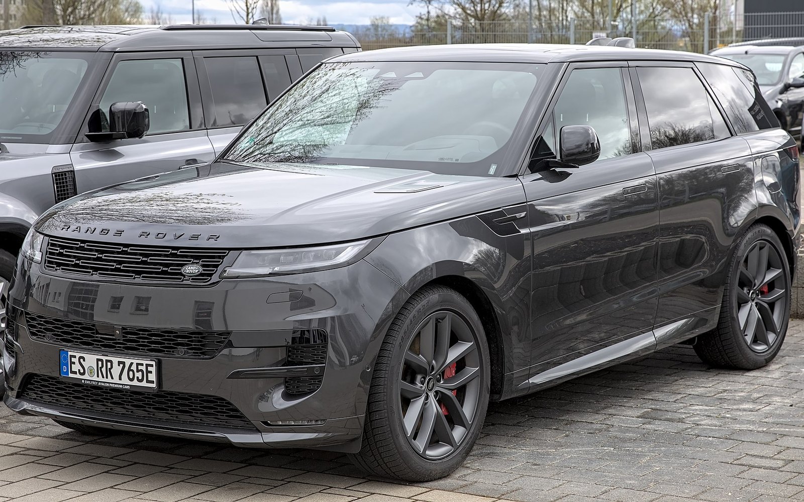 Range Rover Sport — Grey Range Rover Sport luxury SUV rental car, front three-quarter view