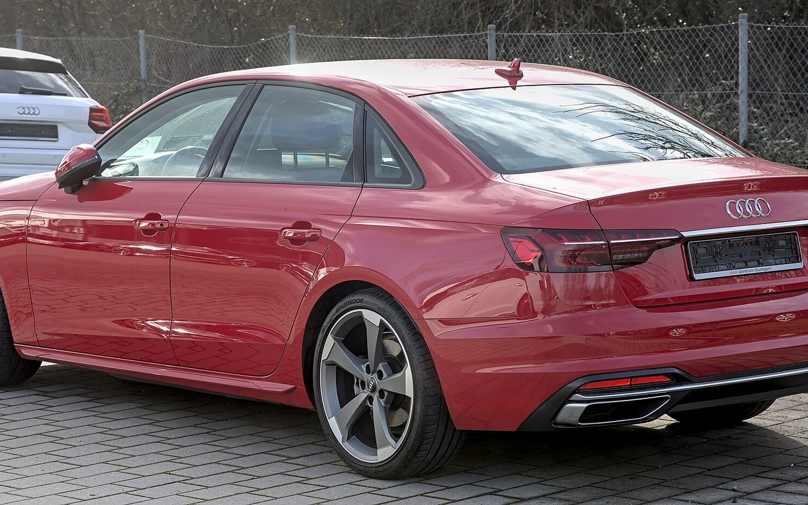 Audi A4 — Red Audi A4 executive sedan rental car, side view